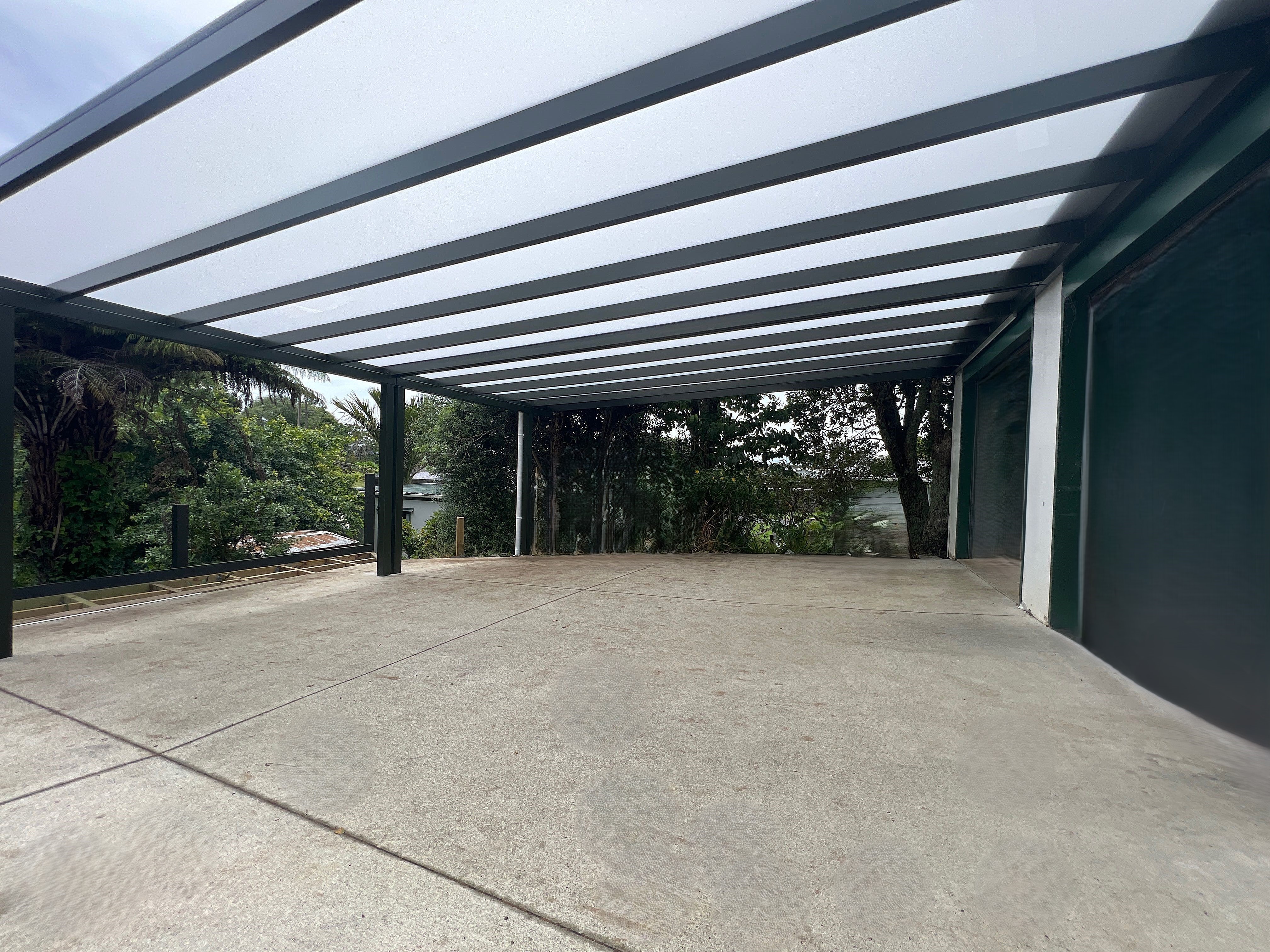 Architectural carport detail in white powder-coated aluminium